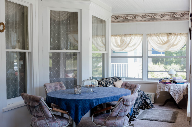 The enclosed front porch is loved and used through much of the year.