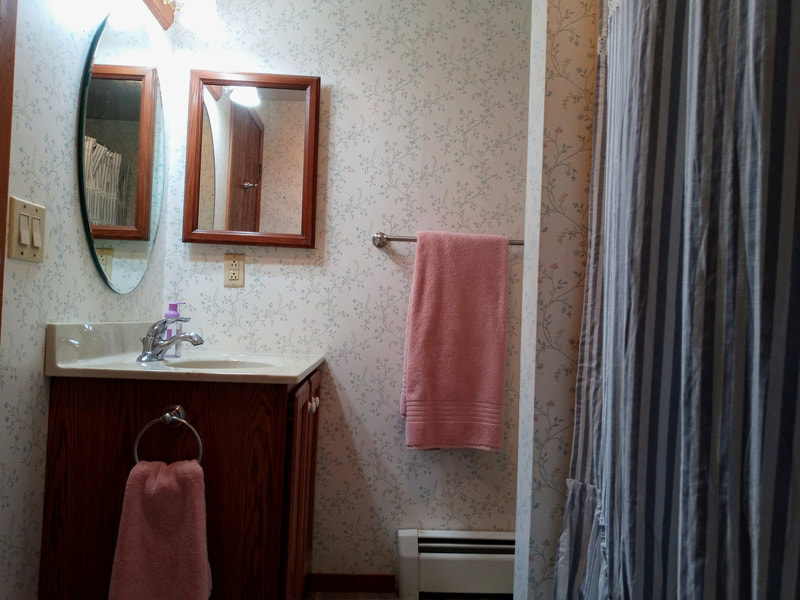 It is so handy to have two bathrooms at Candlelite Cove, this one with a tub/shower combination.