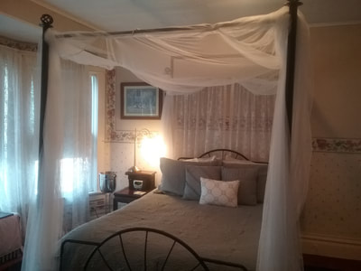 Victorian Room with it's inviting canopy bed.