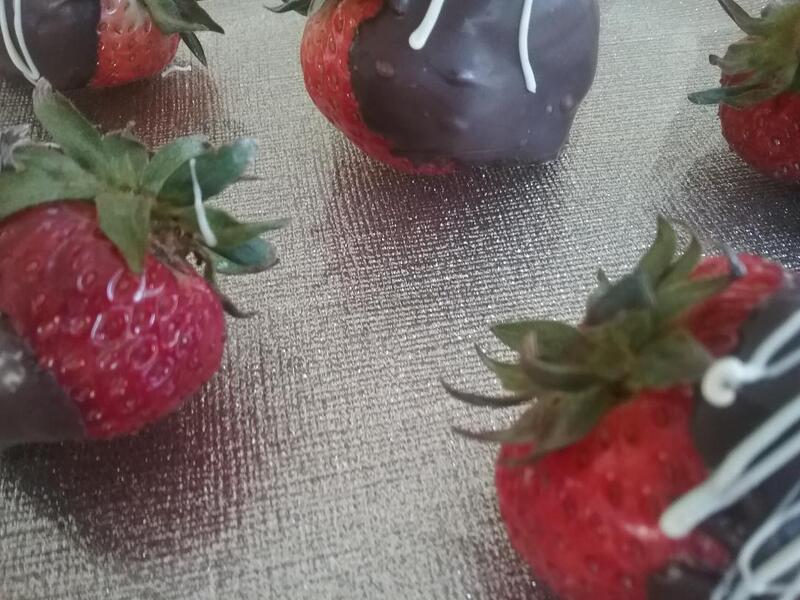 Mouth watering freshly dipped strawberries await.