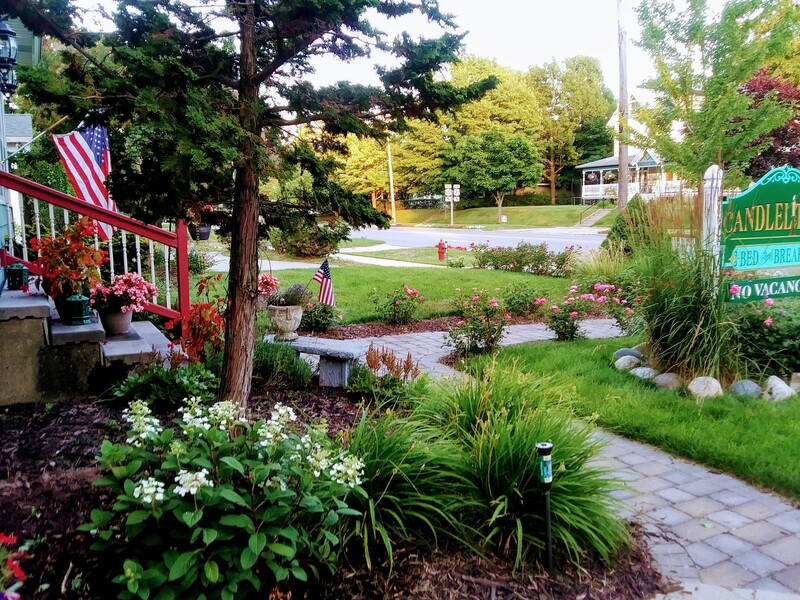 The front walkway of the inn is aligned with roses and lovely plants that bloom all summer long.