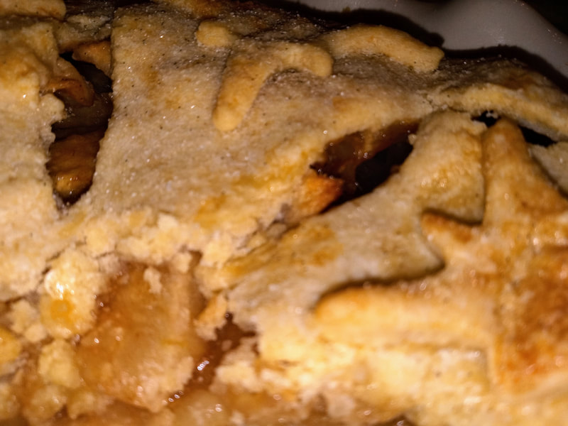 Deep dish apple pie is still warm and gooey. 