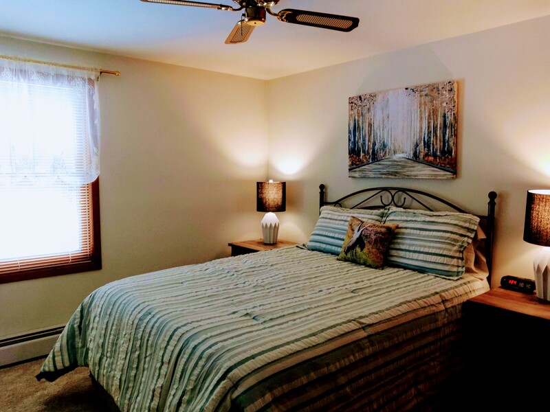 The largest bedroom offers a new queen bed, large flat screen television, and everything for sweet dreams.