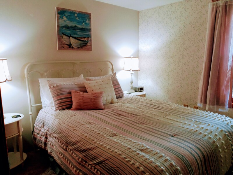 One of the three comfortable bedrooms with all new linens, comforters and premium mattresses.