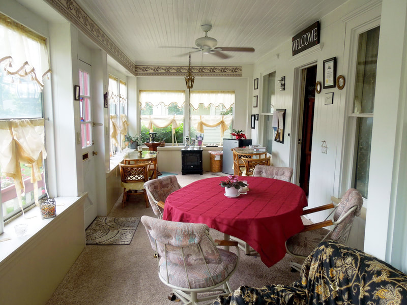Front porch offers games, cards, chilled beverages and several sitting areas.