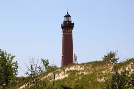 Hidden behind the sand dune is the rest of one of our tallest lighthouses in Michigan.
