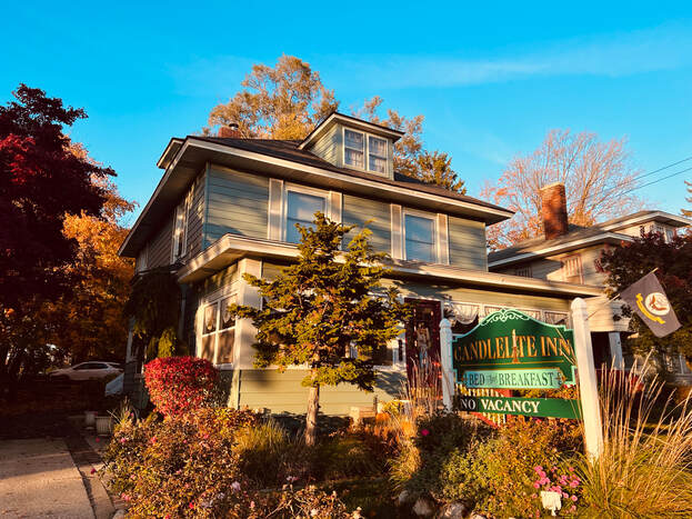 Candlelite Inn's front exterior shines under bright blue autumn skies.