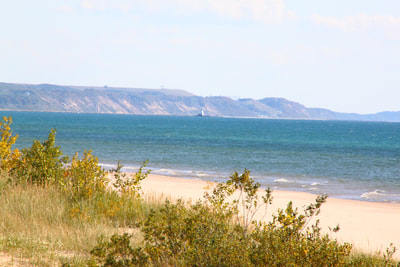 Lake Michigan, sand dunes and one of our Ludington lighthouses in the distance.