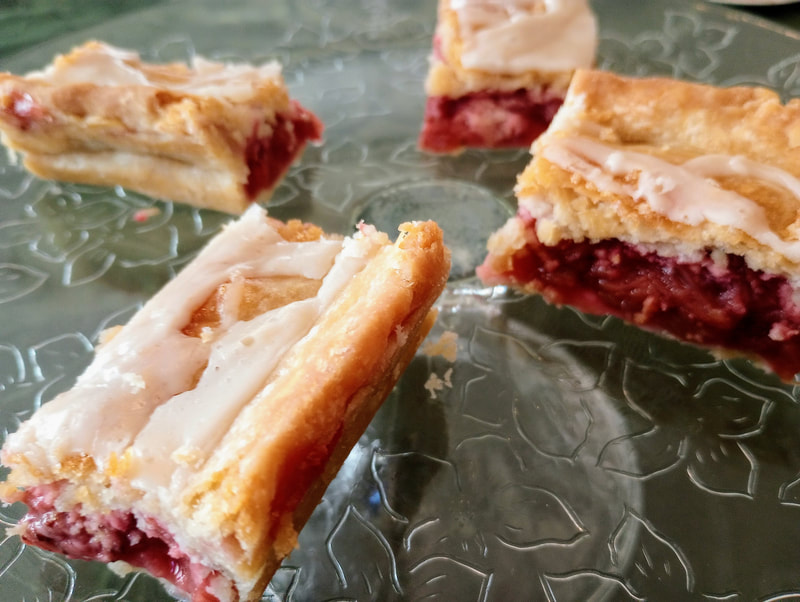 Iced strawberry rhubarb bars with a flaky crust are mouthwateringly delightful at Candlelite Inn Bed & Breakfast of Ludington.