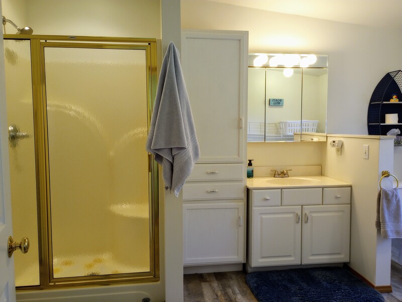 This is one spacious bathroom with plenty of additional storage.